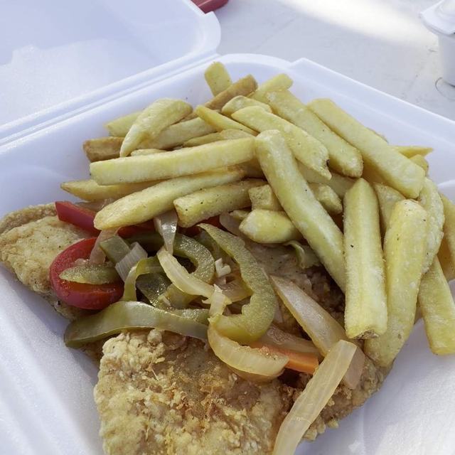 Fish with fries and vegetables